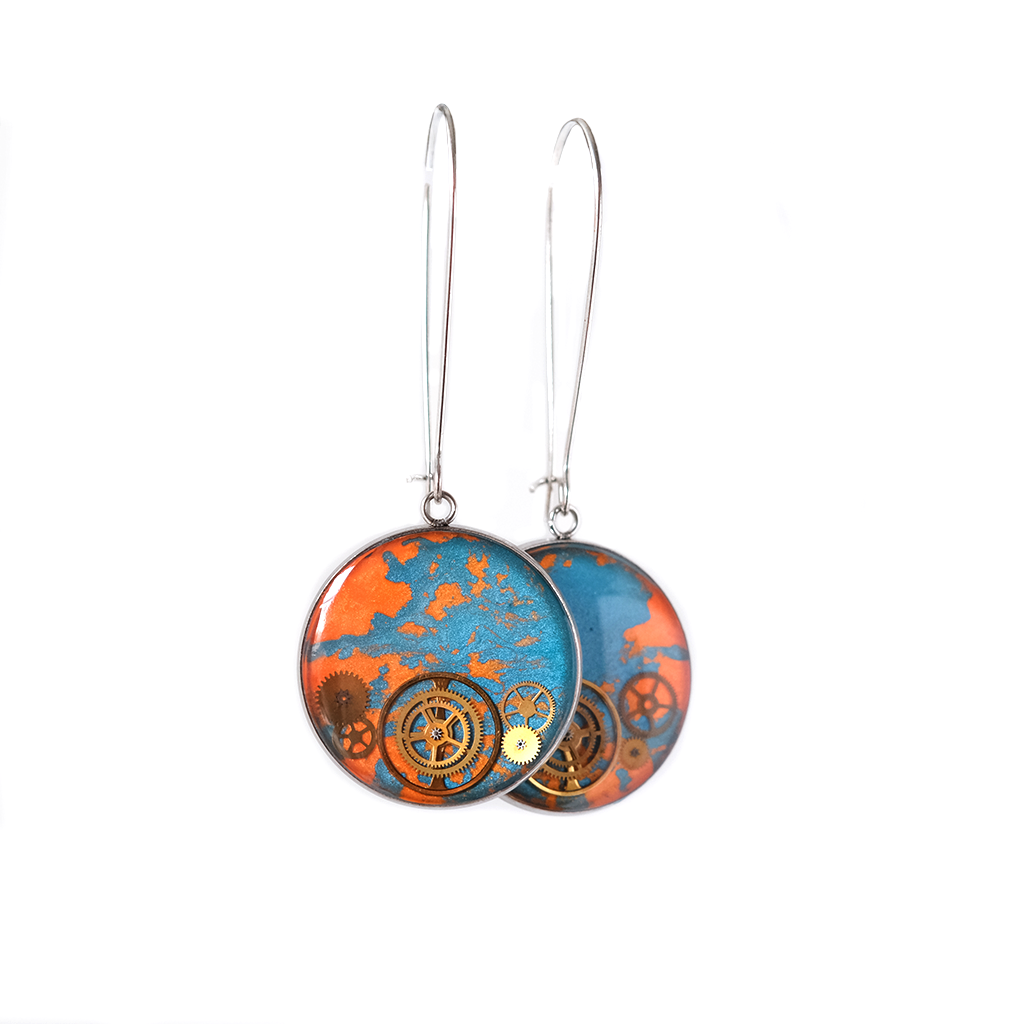 Handmade earrings featuring recycled watch components sealed in resin